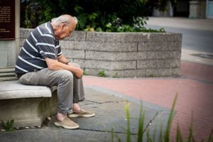 Elder man sitting alone