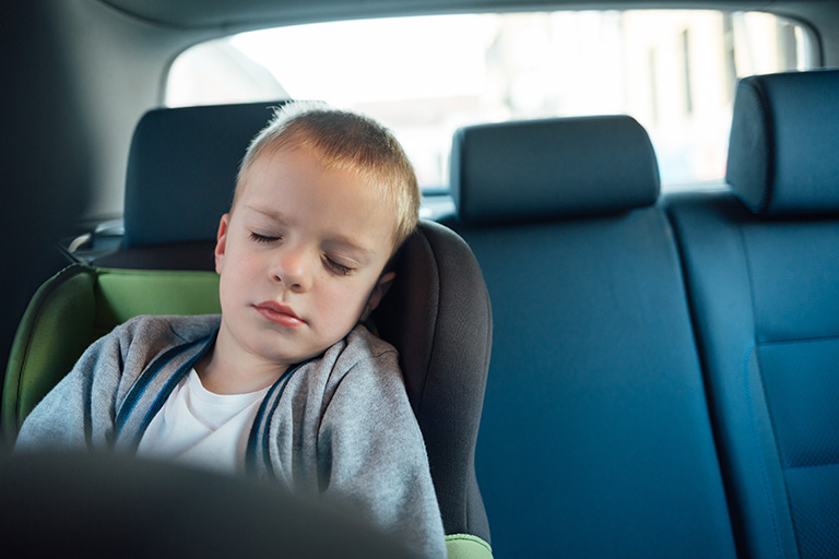 Child sleeping in the car