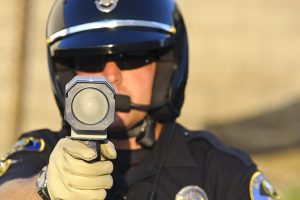 Officer holding speed gun