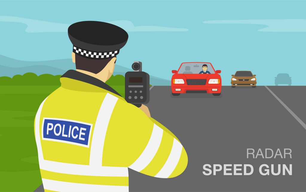Officer holding speed gun